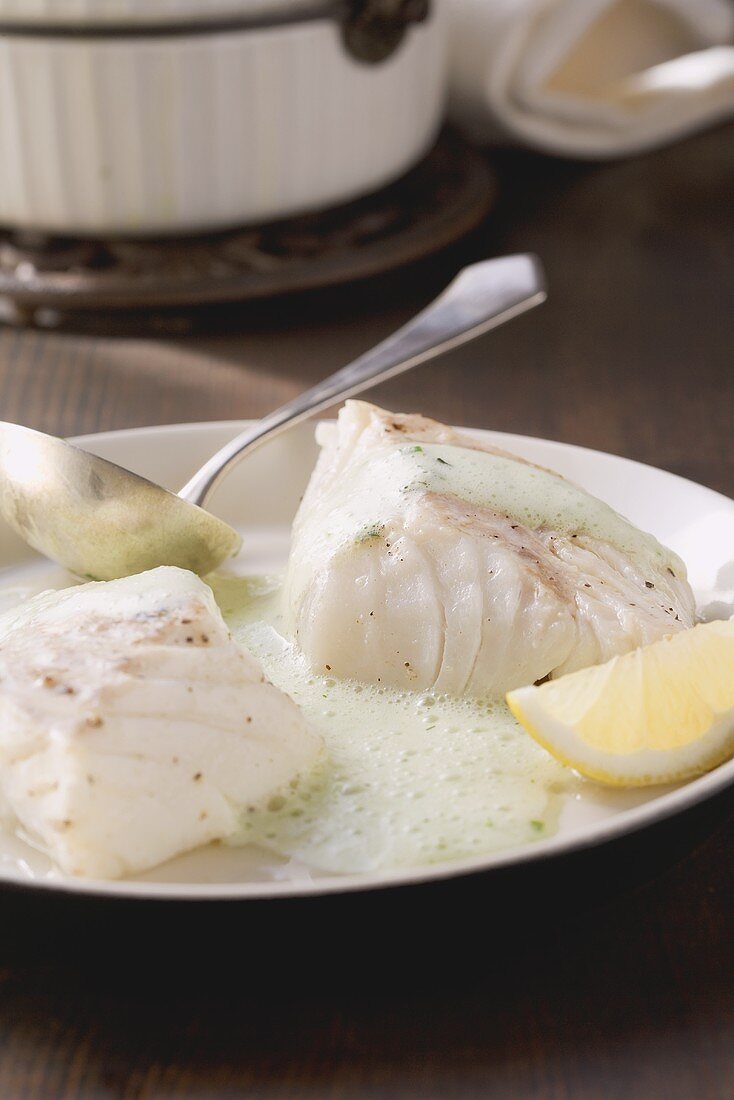 Poached cod with herb sauce