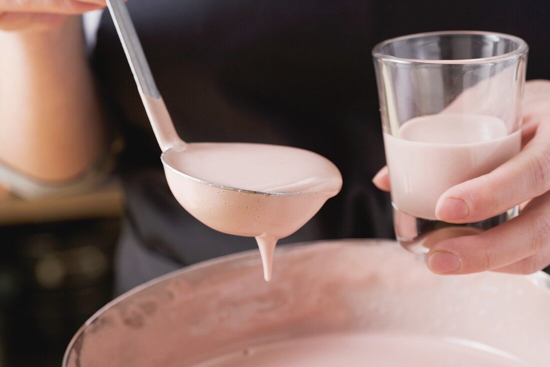 Zabaione being poured into a glass