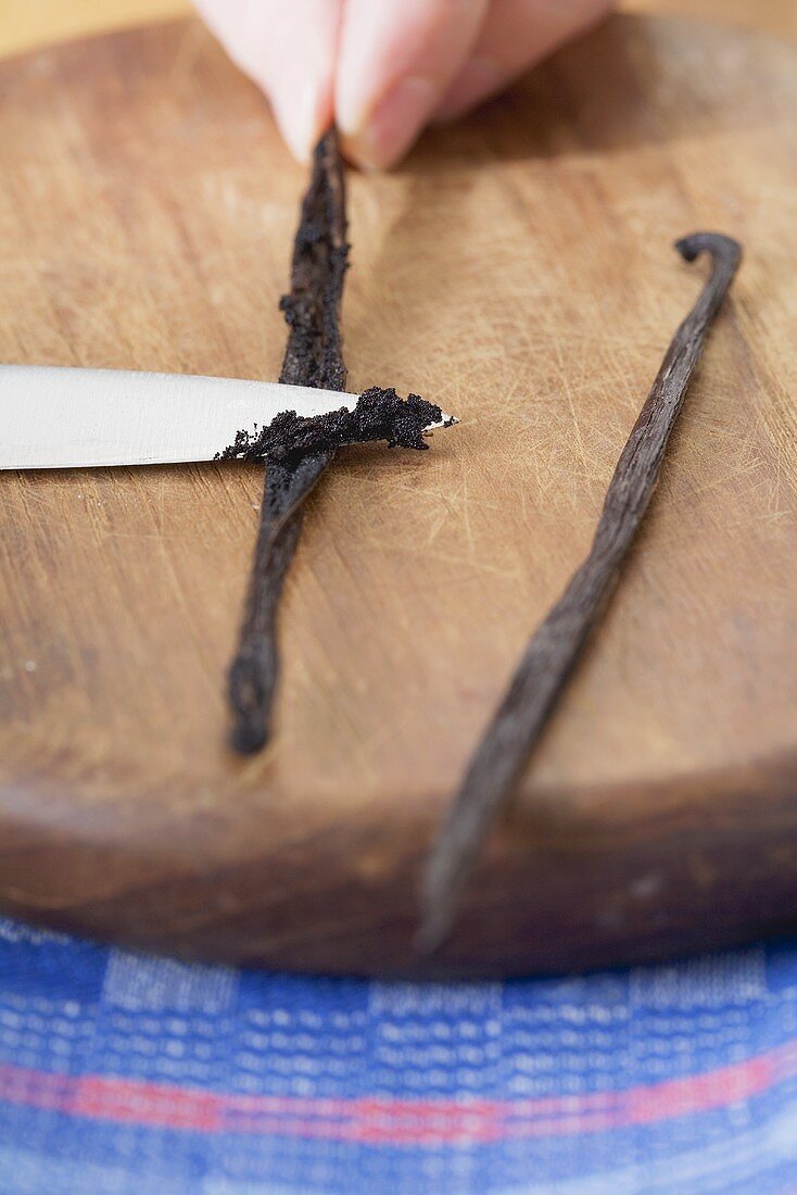 Vanilla seeds being scrapped out of the pod