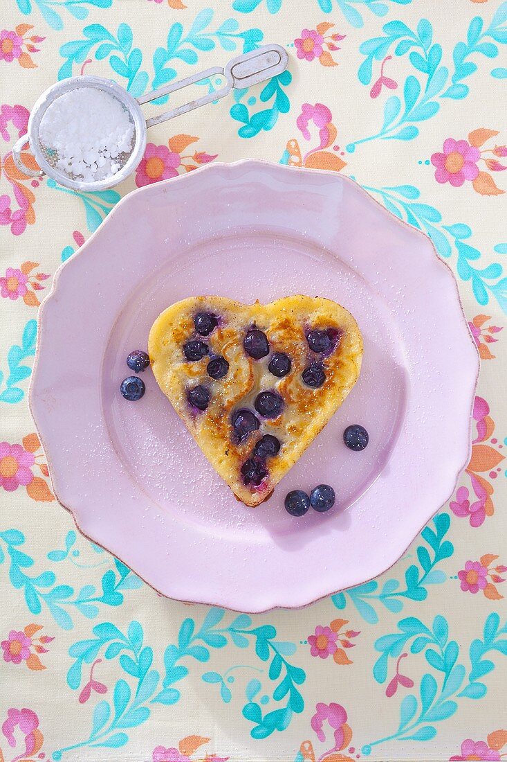A heart-shaped blueberry pancakes