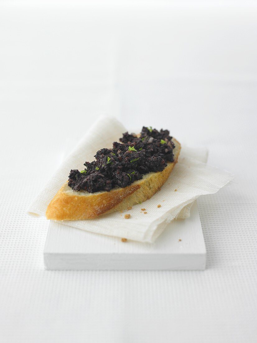 Baguette slice with Bloodwurst (Caviar of Cologne)