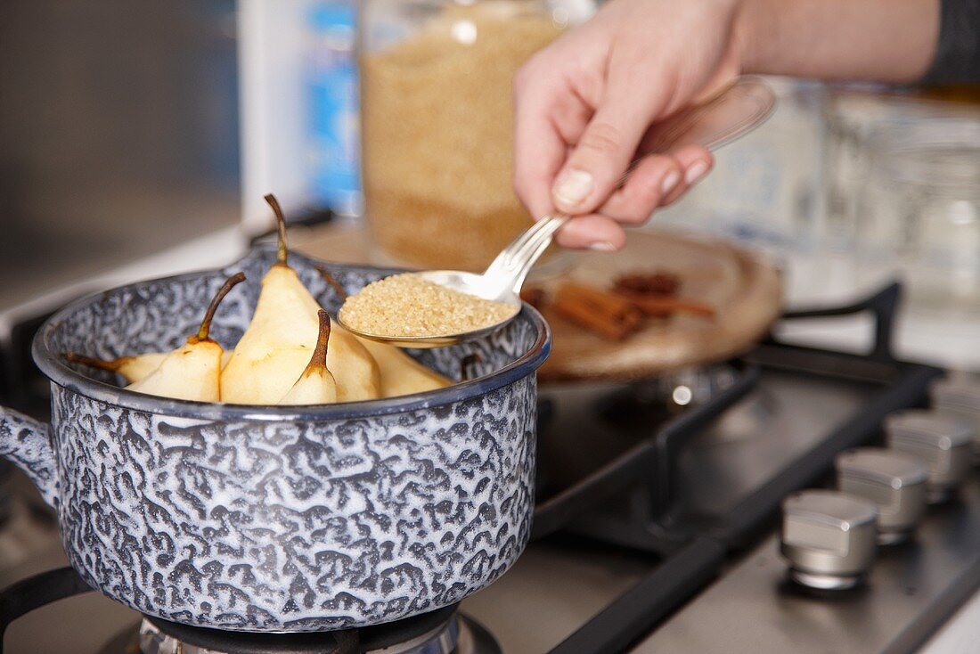 Adding brown sugar to peeled pears