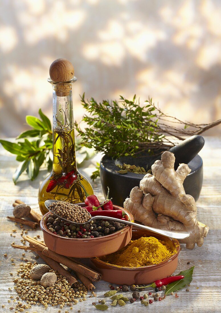 Sill life with spices, herbs and herb oil