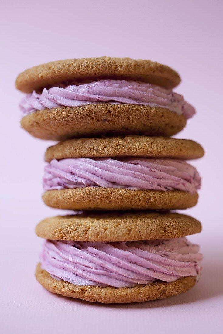 Three stacked whoopie pies with raspberry filling