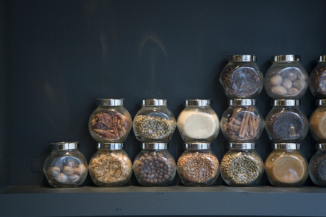 Many different spices in screw top jars