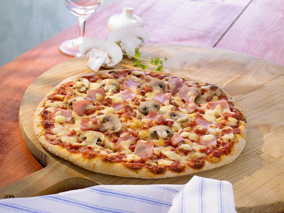 Pizza al funghi with mushrooms and ham