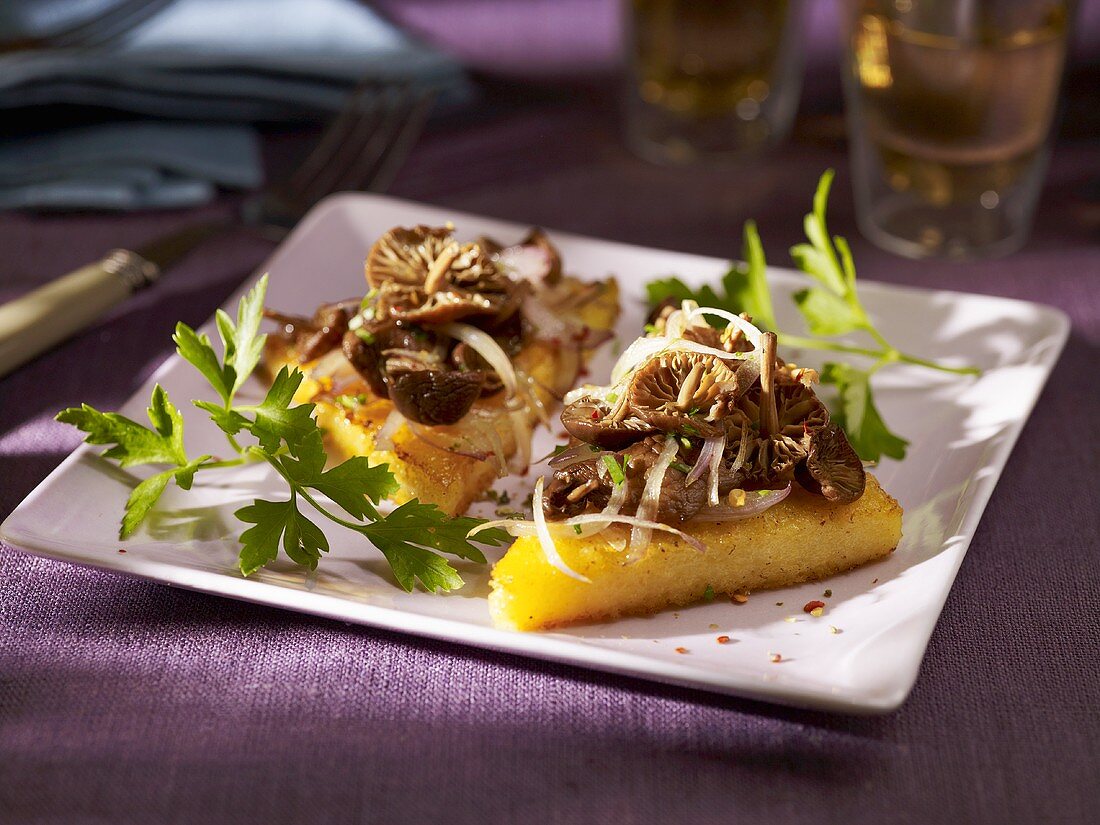 Slices of polenta with mushrooms