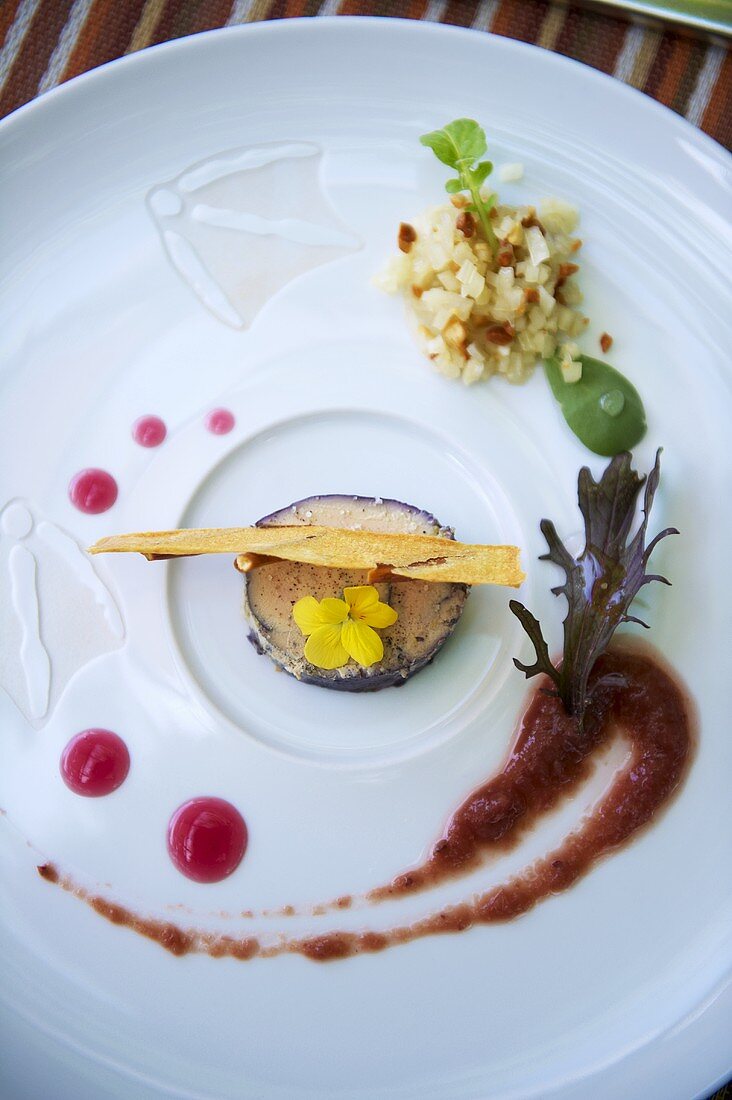 Goose live with edible flowers and sauce
