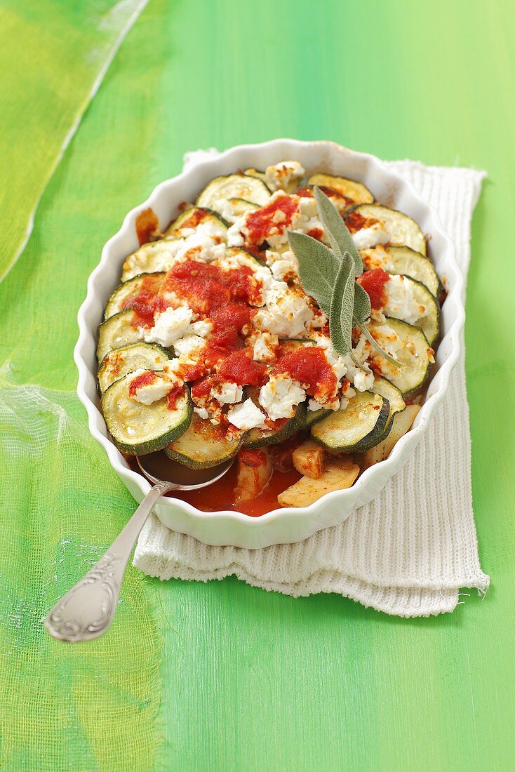 Zucchini casserole with tomatoes, cheese and sage