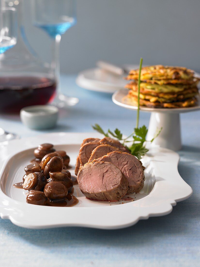 Pork medallions with courgette cakes