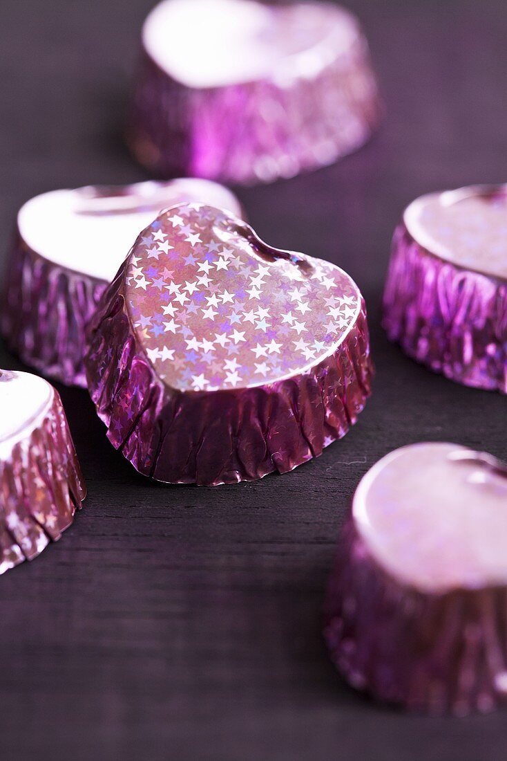 Purple-coloured, heart-shaped pralines