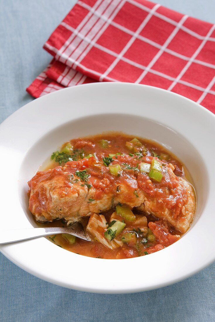 Salmon fillet in a vegetable and tomato sauce