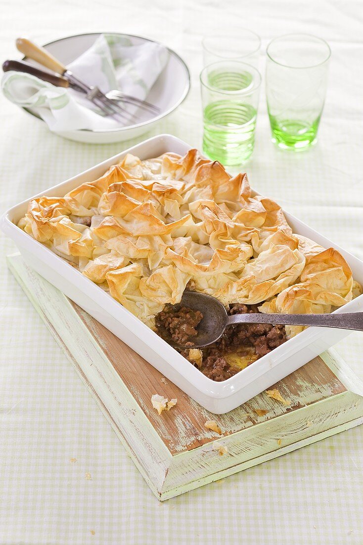 A lamb pie with a puff pastry lid