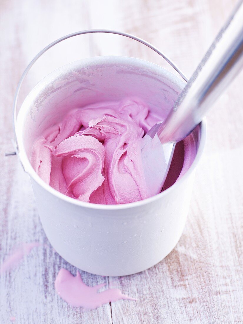 A pot of homemade raspberry ice cream