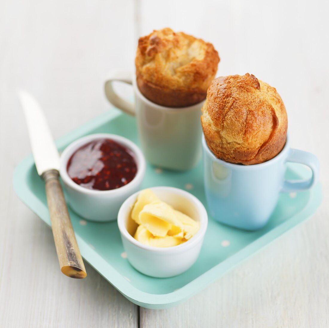 Popovers (American breakfast pastries) with butter and jam