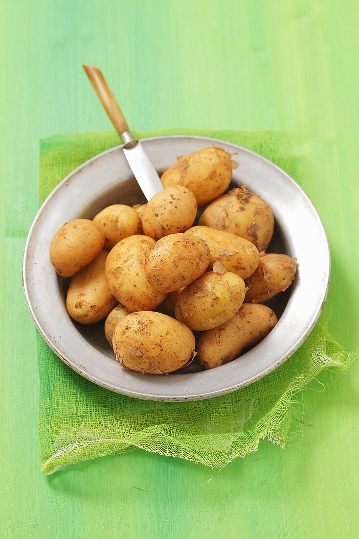 New potatoes on a metal plate