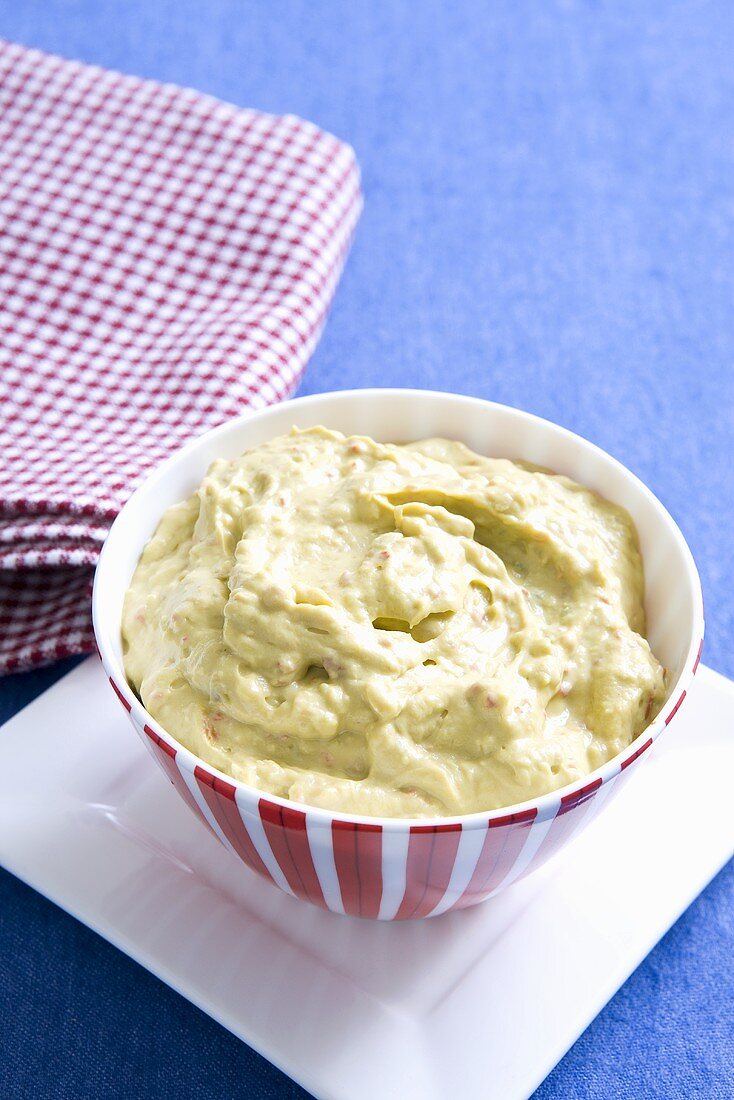 Classic Guacamole in a Glass Bowl; Fresh Avocados