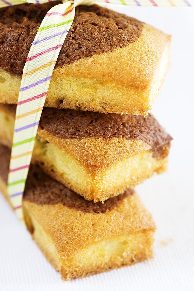 A stack of mini marble cakes tied with a ribbon