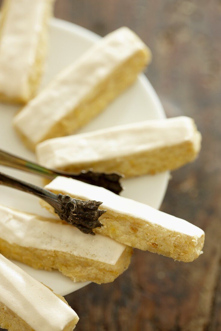 Orange sticks and cake tongs