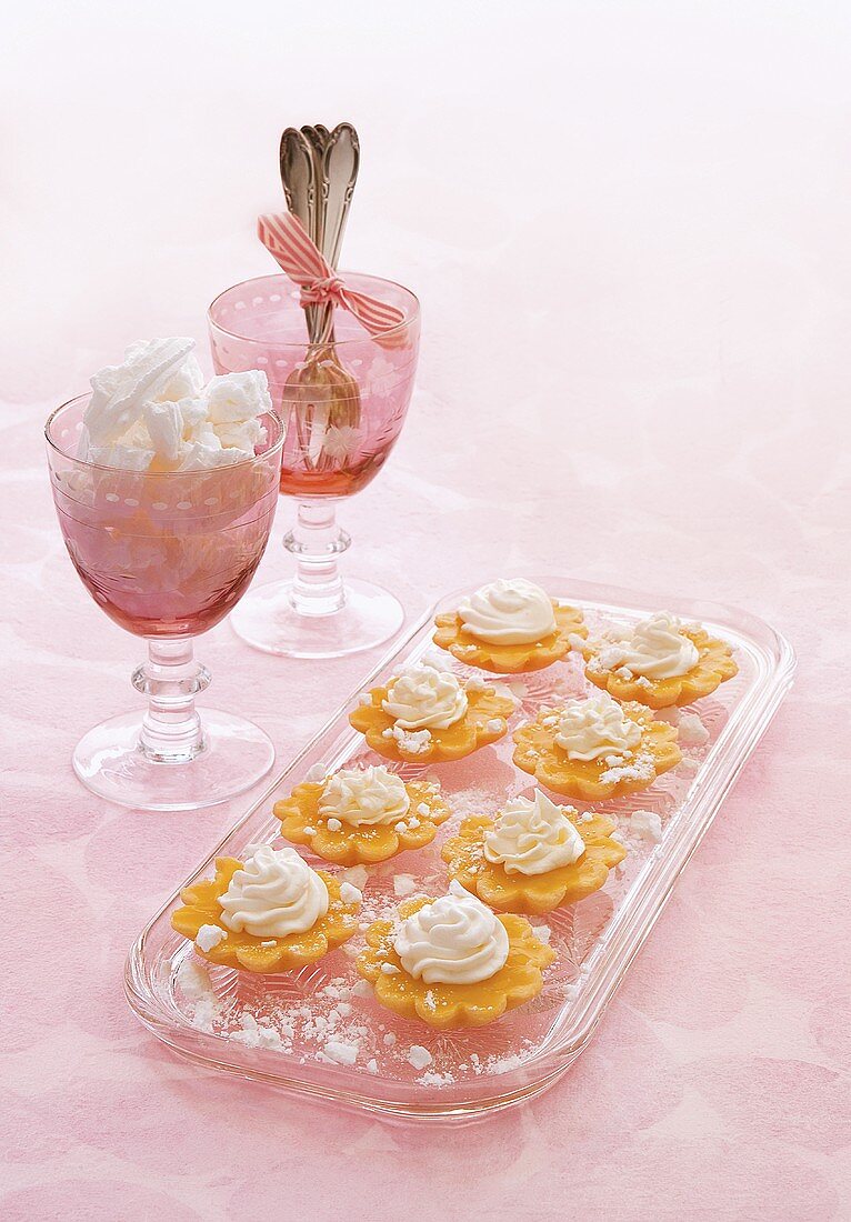 Lemon tartlets with cream and meringue