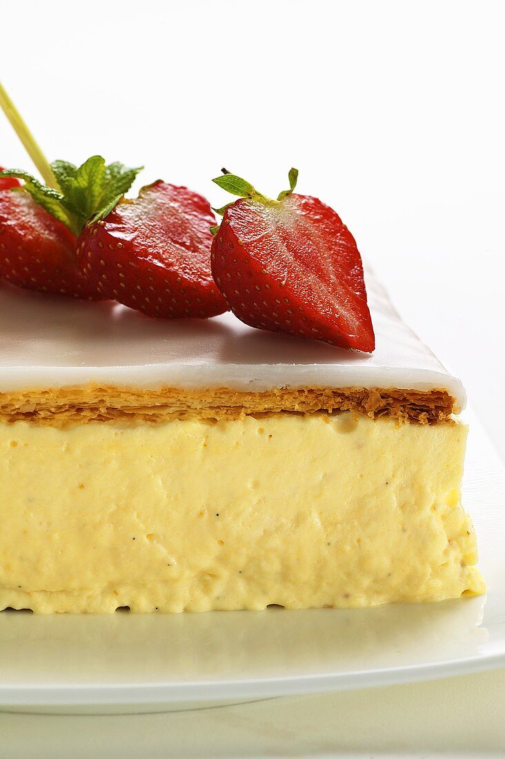 A cream slice with strawberries