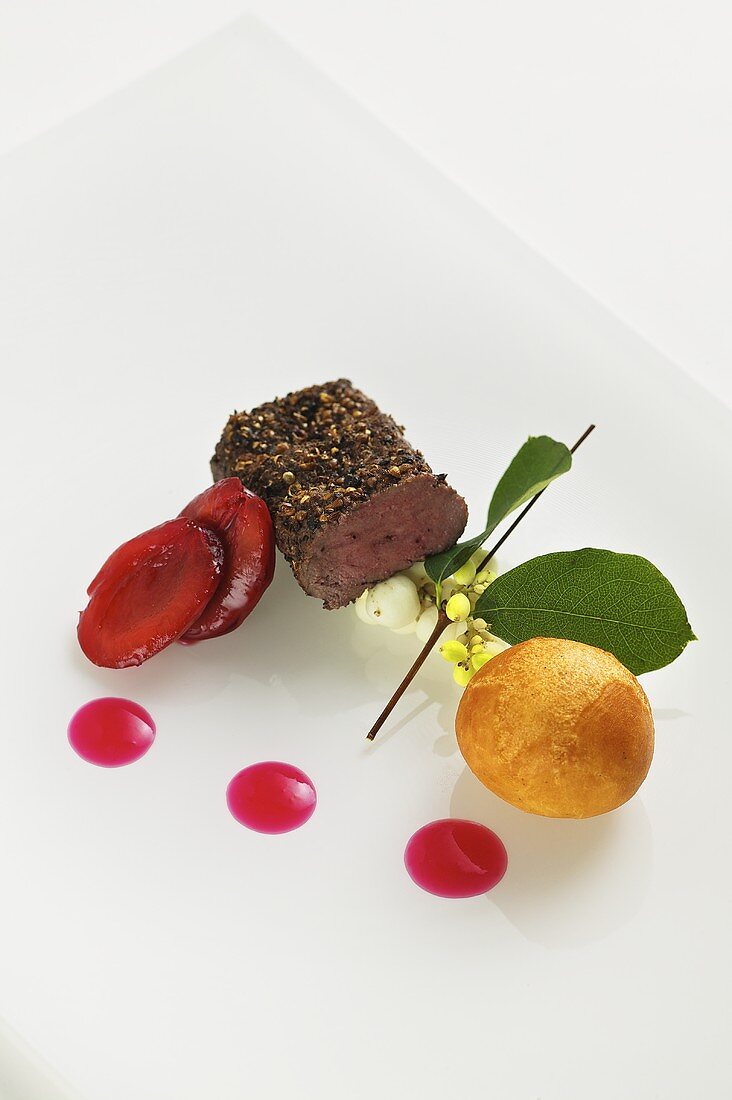 Venison with lingonberry dumplings and plums