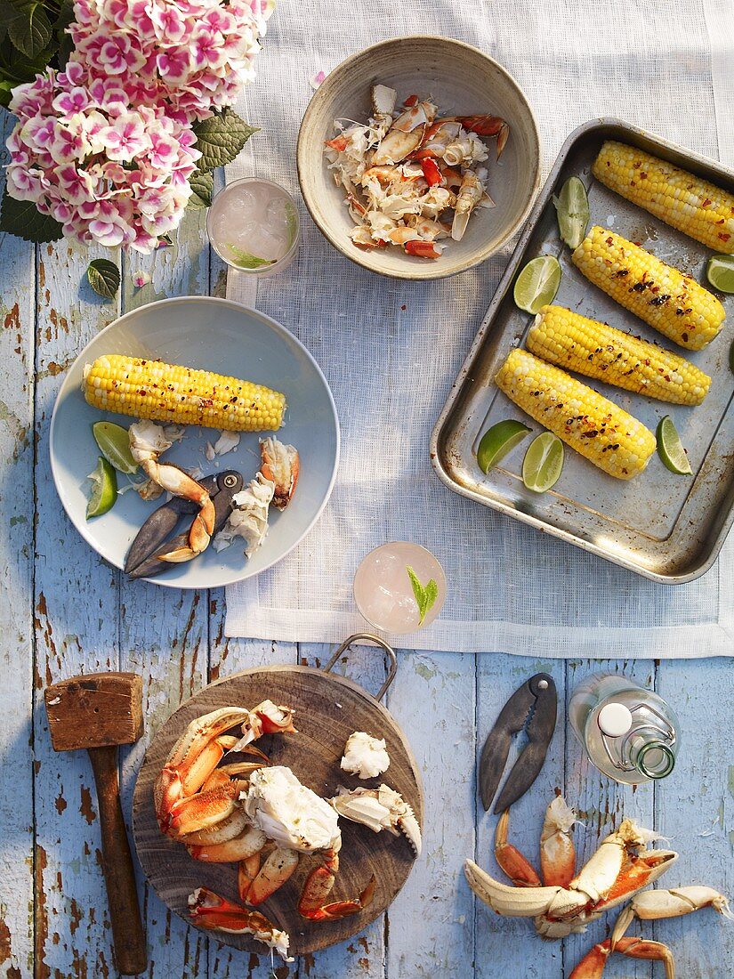 Crab and corn cobs on a rustic table