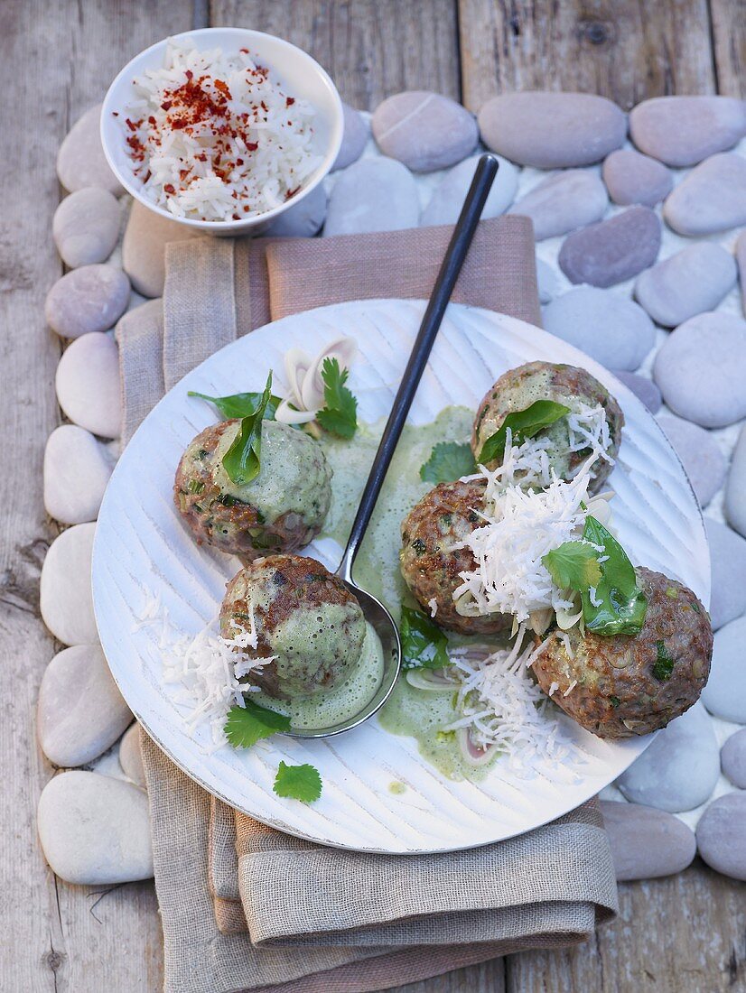 Thai meatballs with green curry sauce and coconut