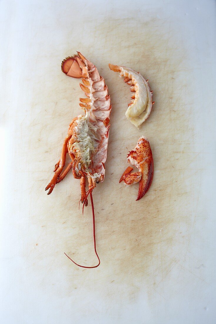 Pieces of lobster on a chopping board