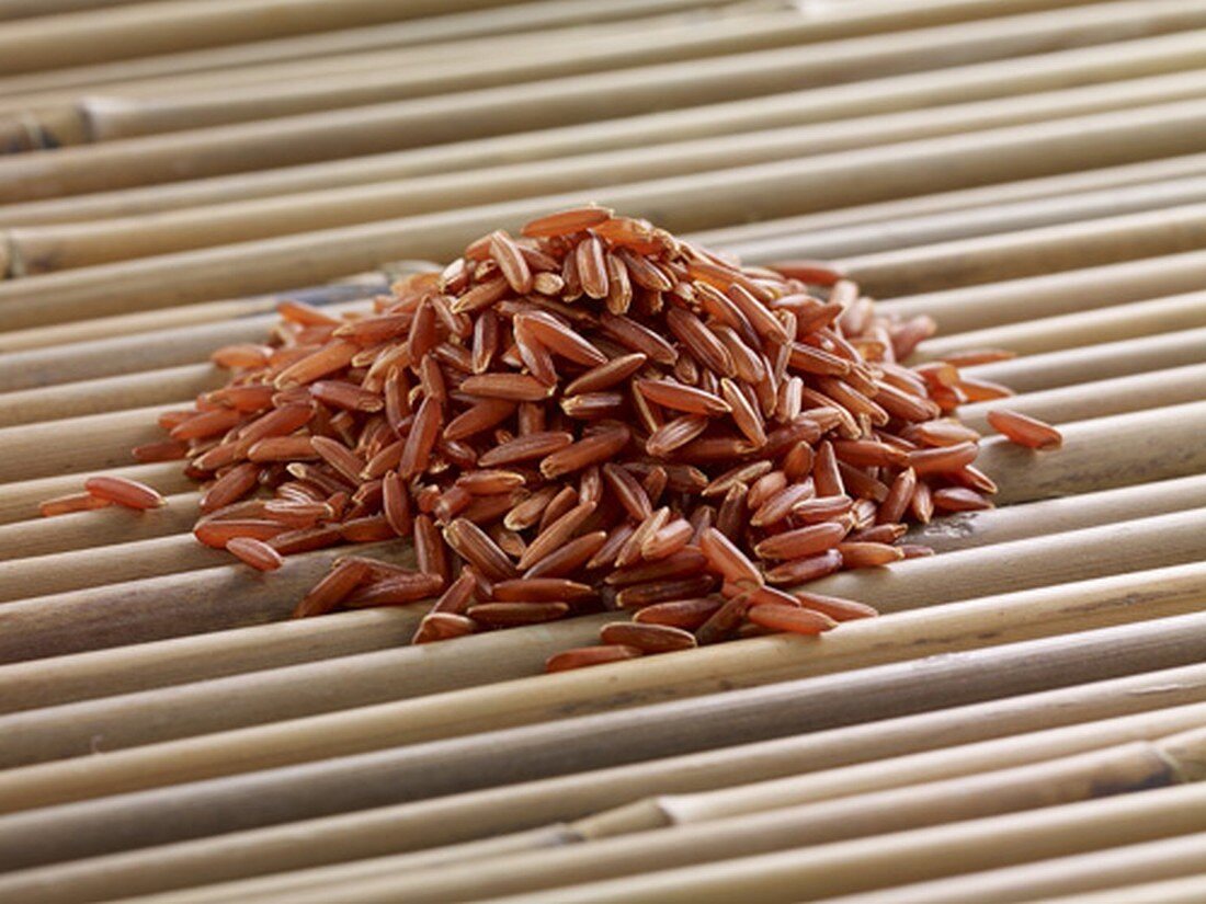 Red rice on bamboo sticks