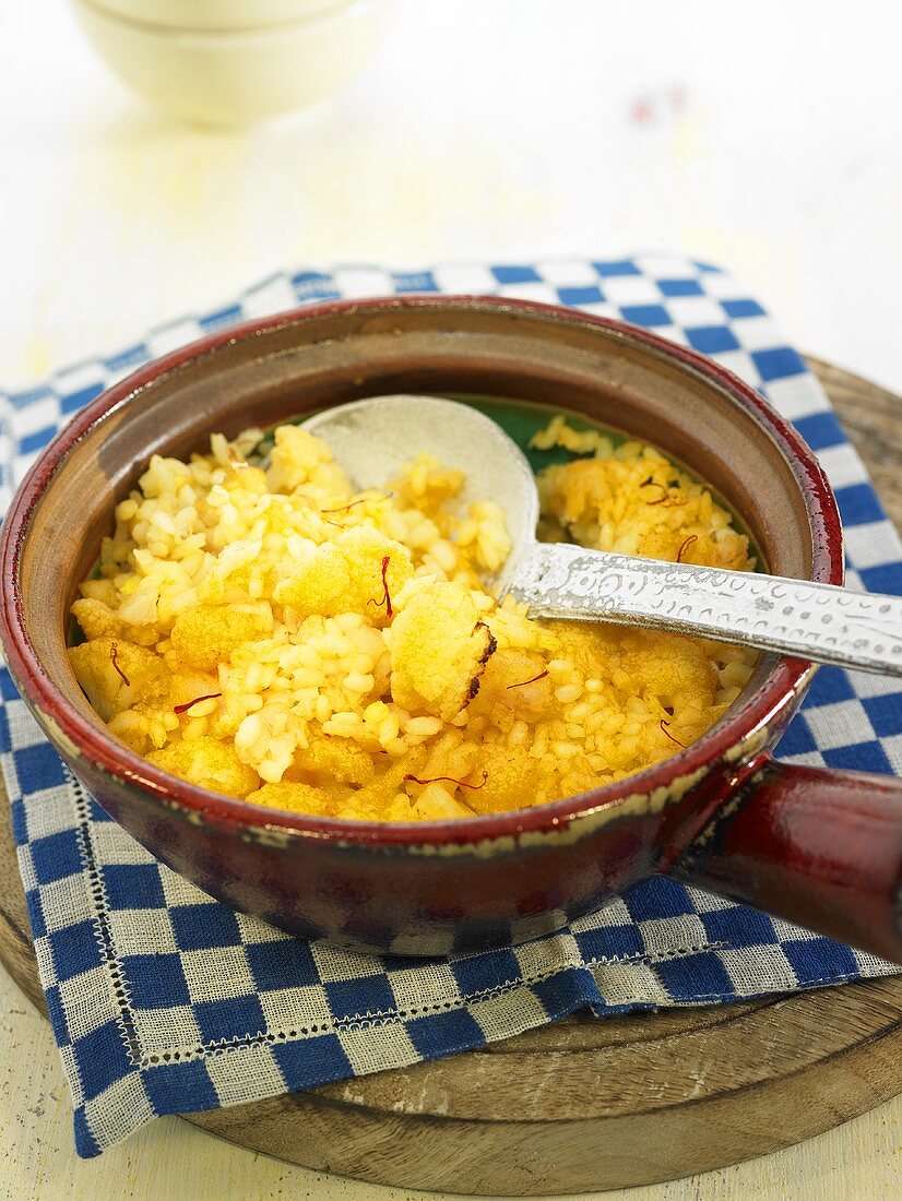Arroz al horno (oven-baked rice, Spain) with cauliflower and stockfish