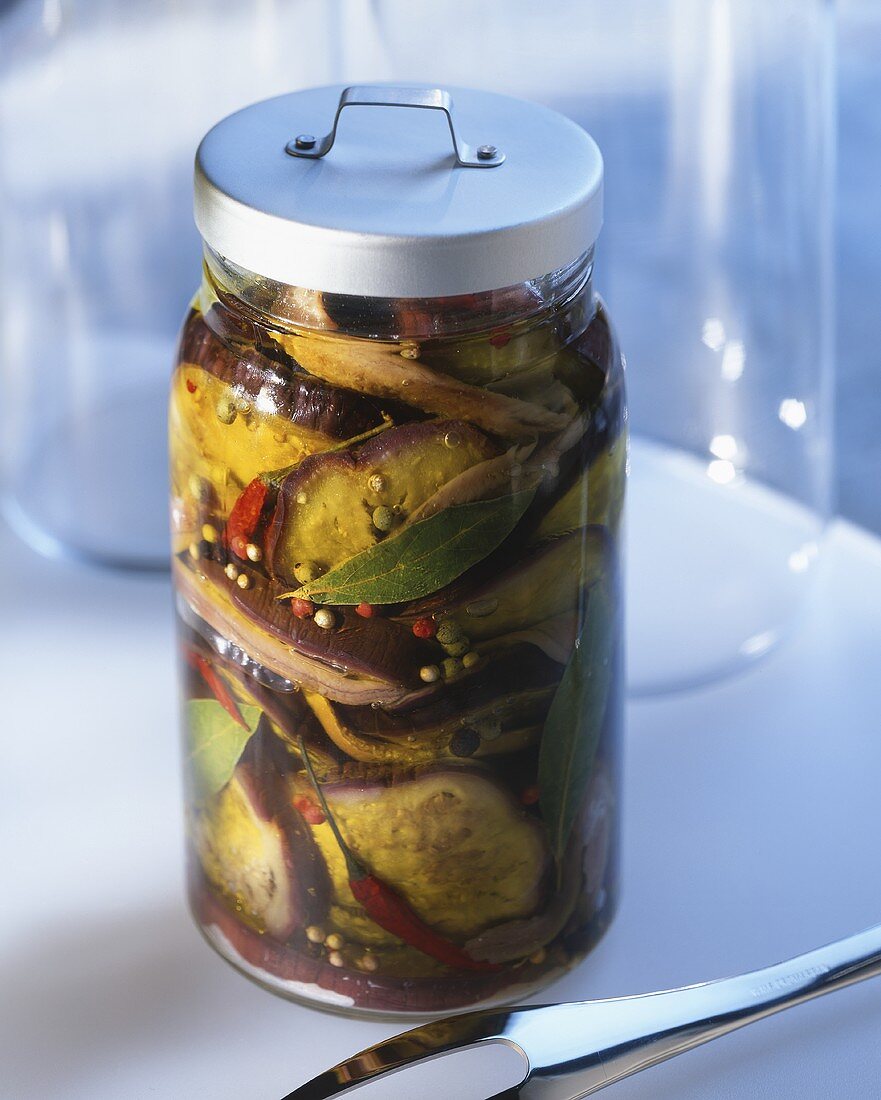 Spicy, pickled aubergines in a preserving jar