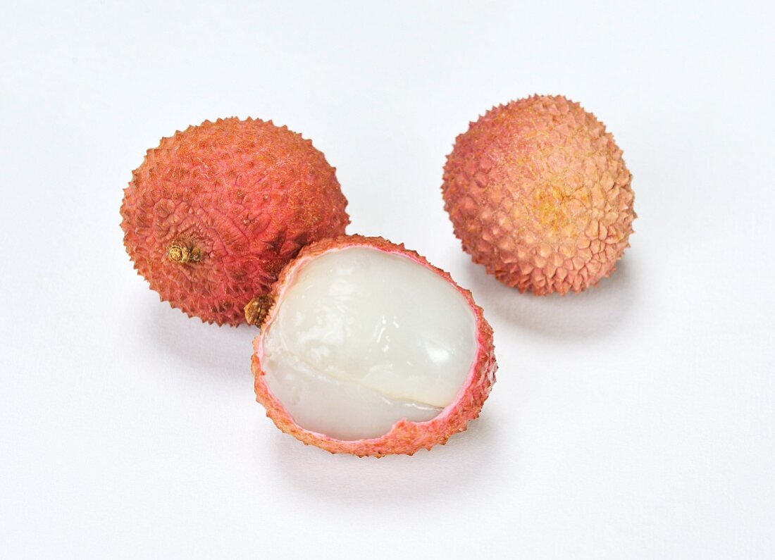 Lychees, whole and partially peeled