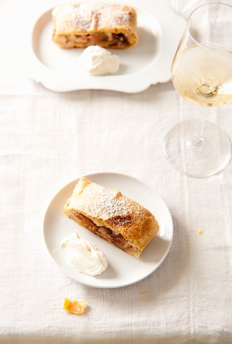Apple strudel and a glass of white wine