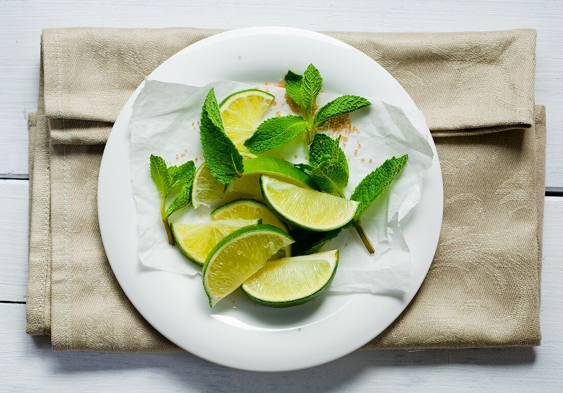 Lime wedges, mint and brown sugar
