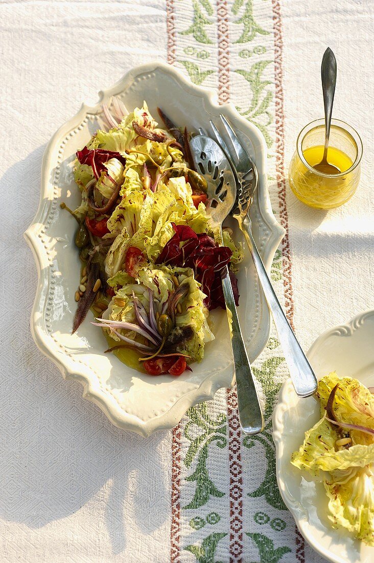 Radicchio salad with sardines, capers and pine nuts