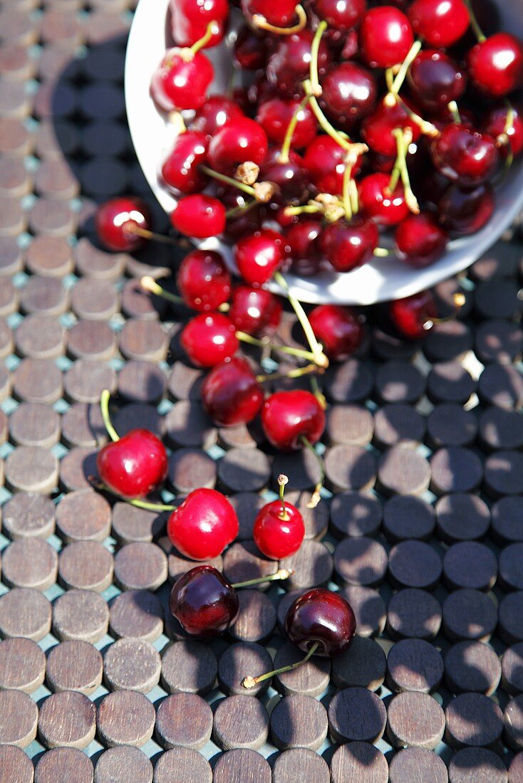 Fresh cherries in a bowl, seen from above