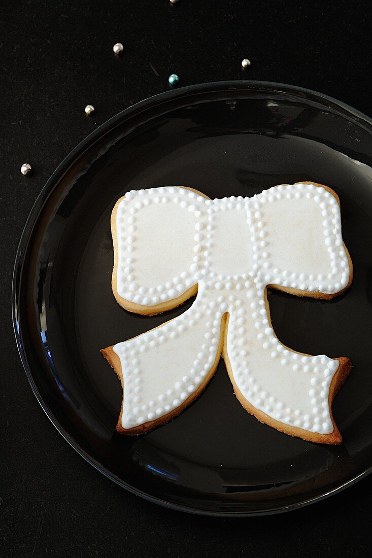 Shortbread biscuits (bows) with white icing