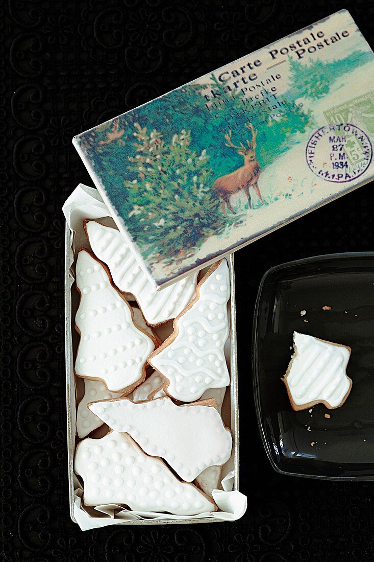 Shortbread biscuits with white icing and a Christmas card