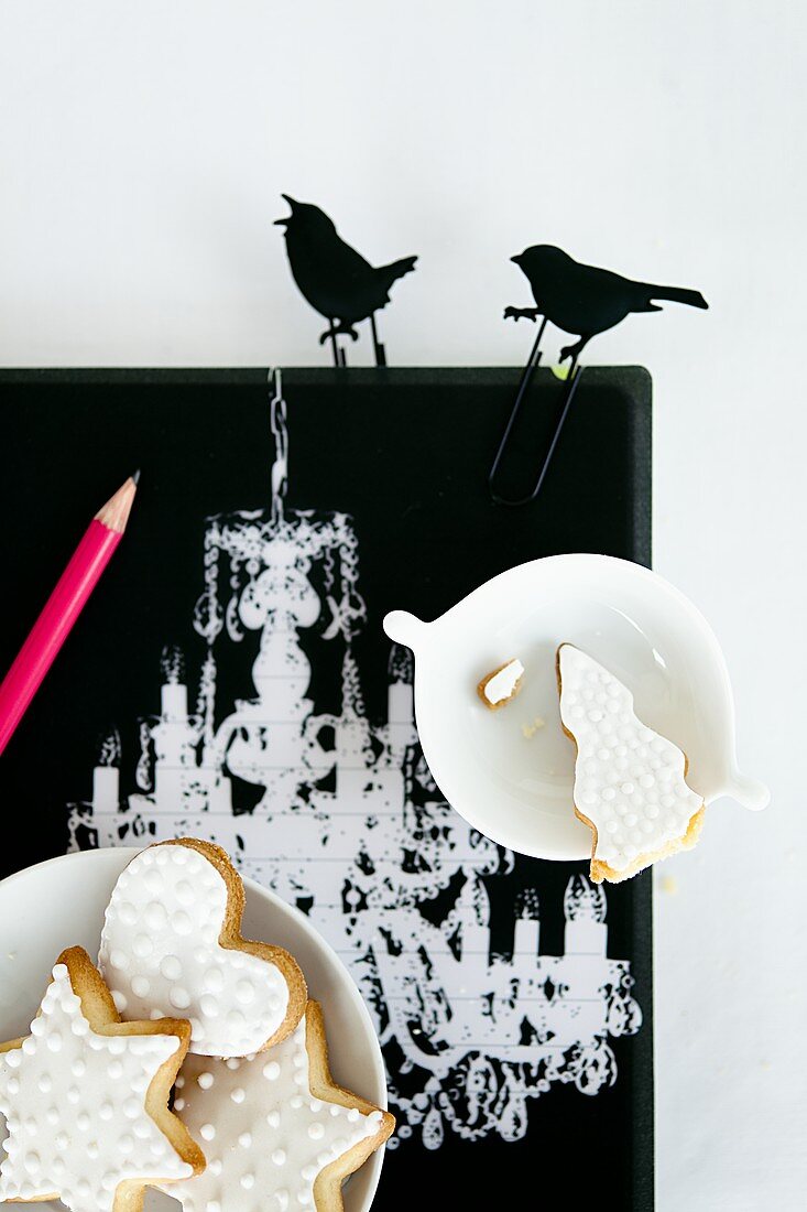 Shortbread biscuits with white icing and decorative black birds