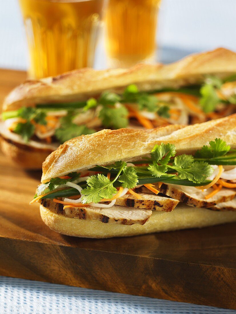 Grilled chicken sandwiches on baguette bread