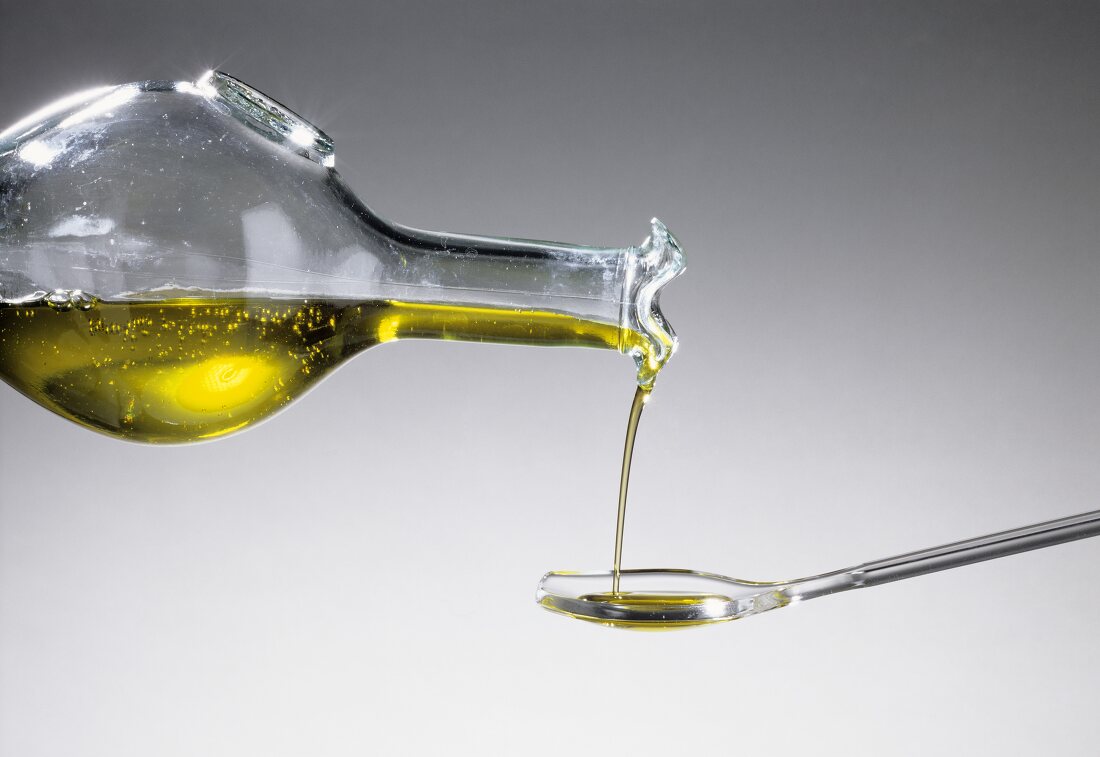 Pouring Olive Oil Onto a Spoon