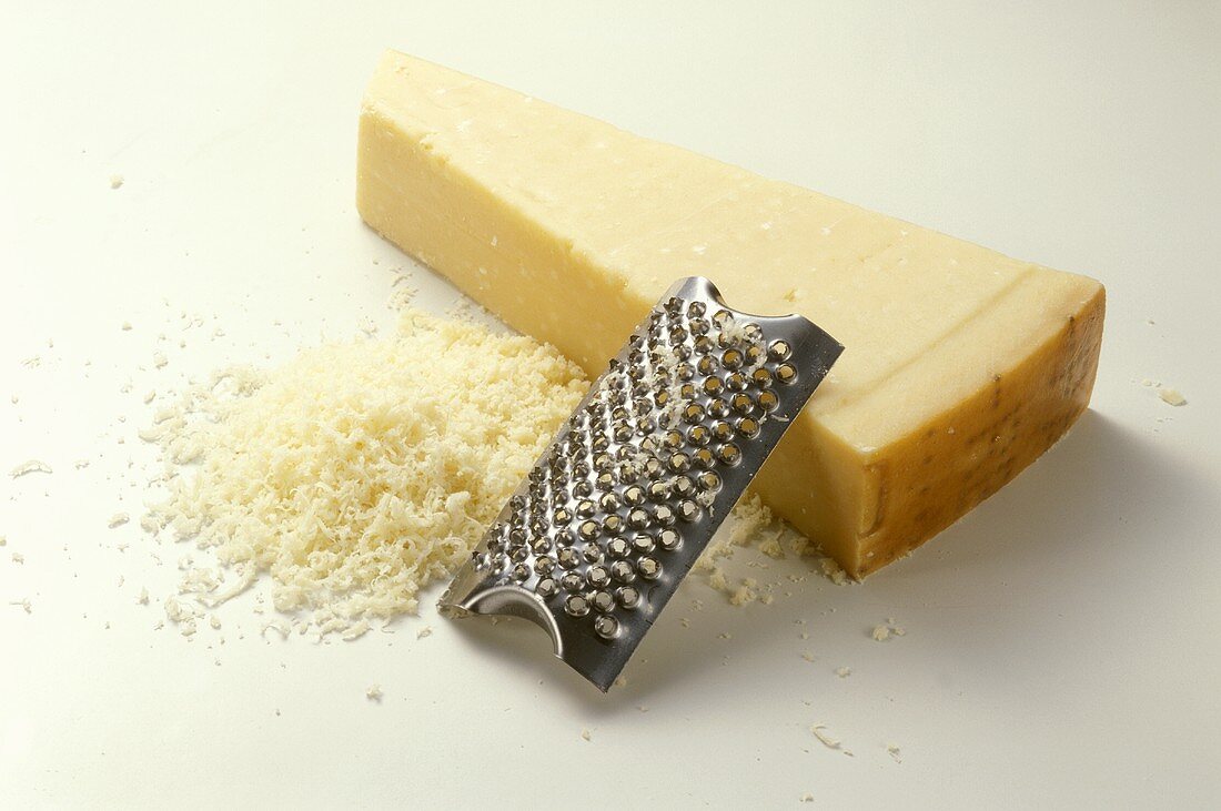 A piece of Parmesan with grater (Emilia-Romagna, Italy)