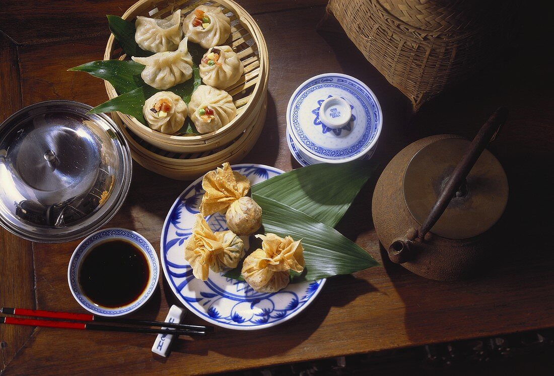 Dim Sum with Chopsticks and Leaves; Bamboo Steamer