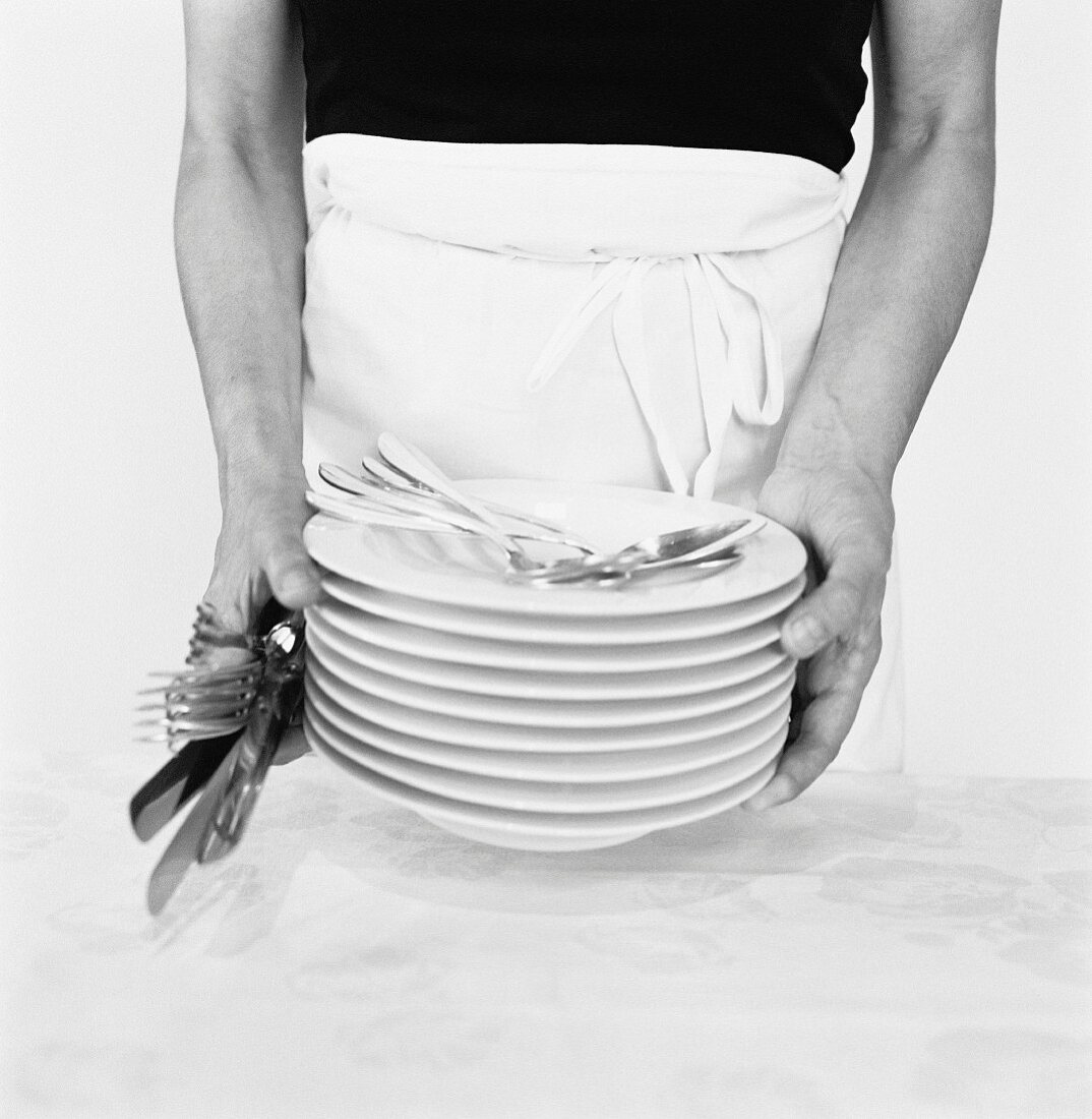 Holding a stack of plates