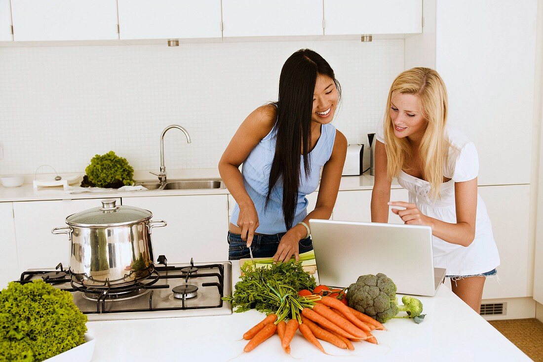 Two young women cooking