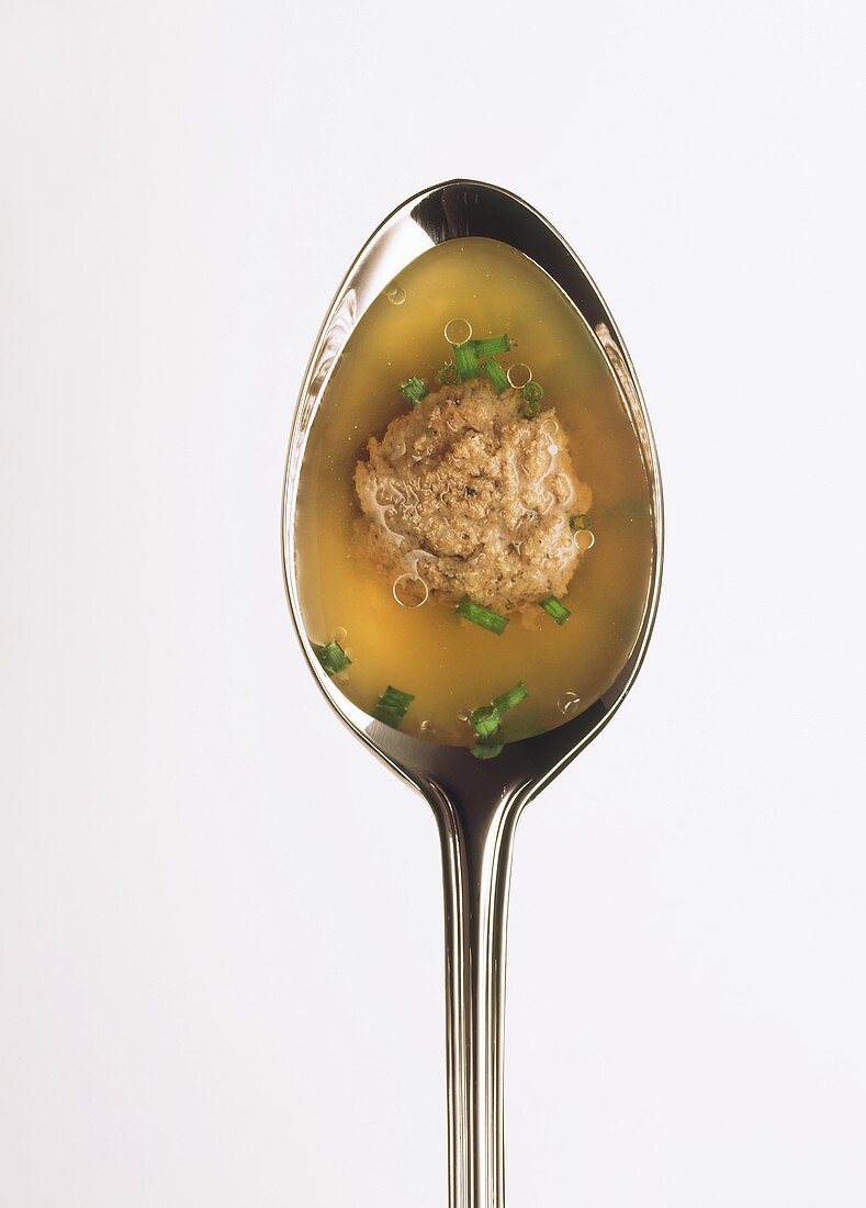 Liver dumpling soup in spoon