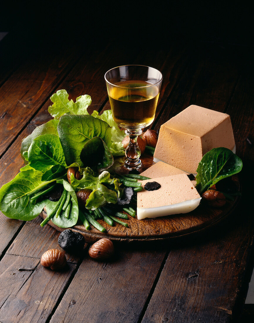 Foie gras mousse with glass of wine and salad