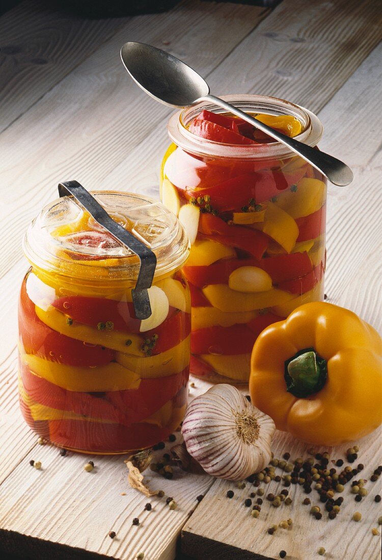 Jars of yellow and red peppers