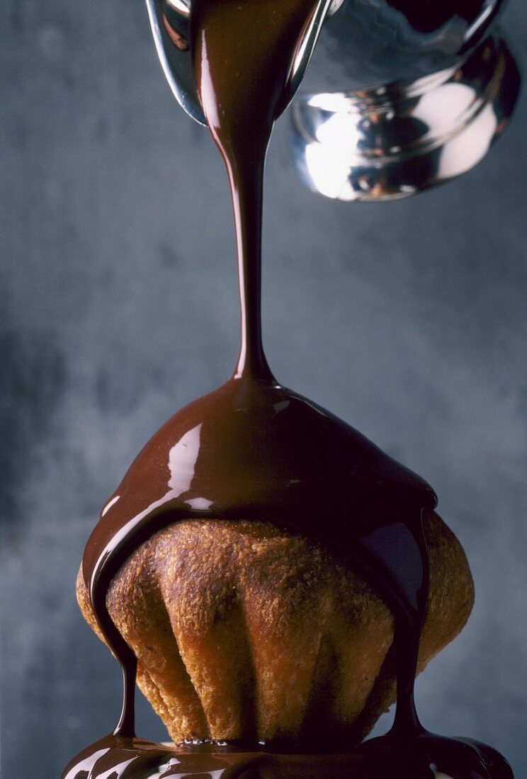 Melted chocolate pouring over brioche